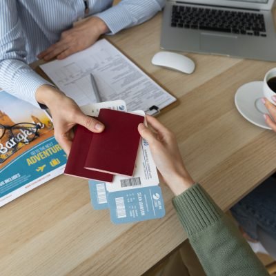 high-angle-woman-working-as-travel-agent